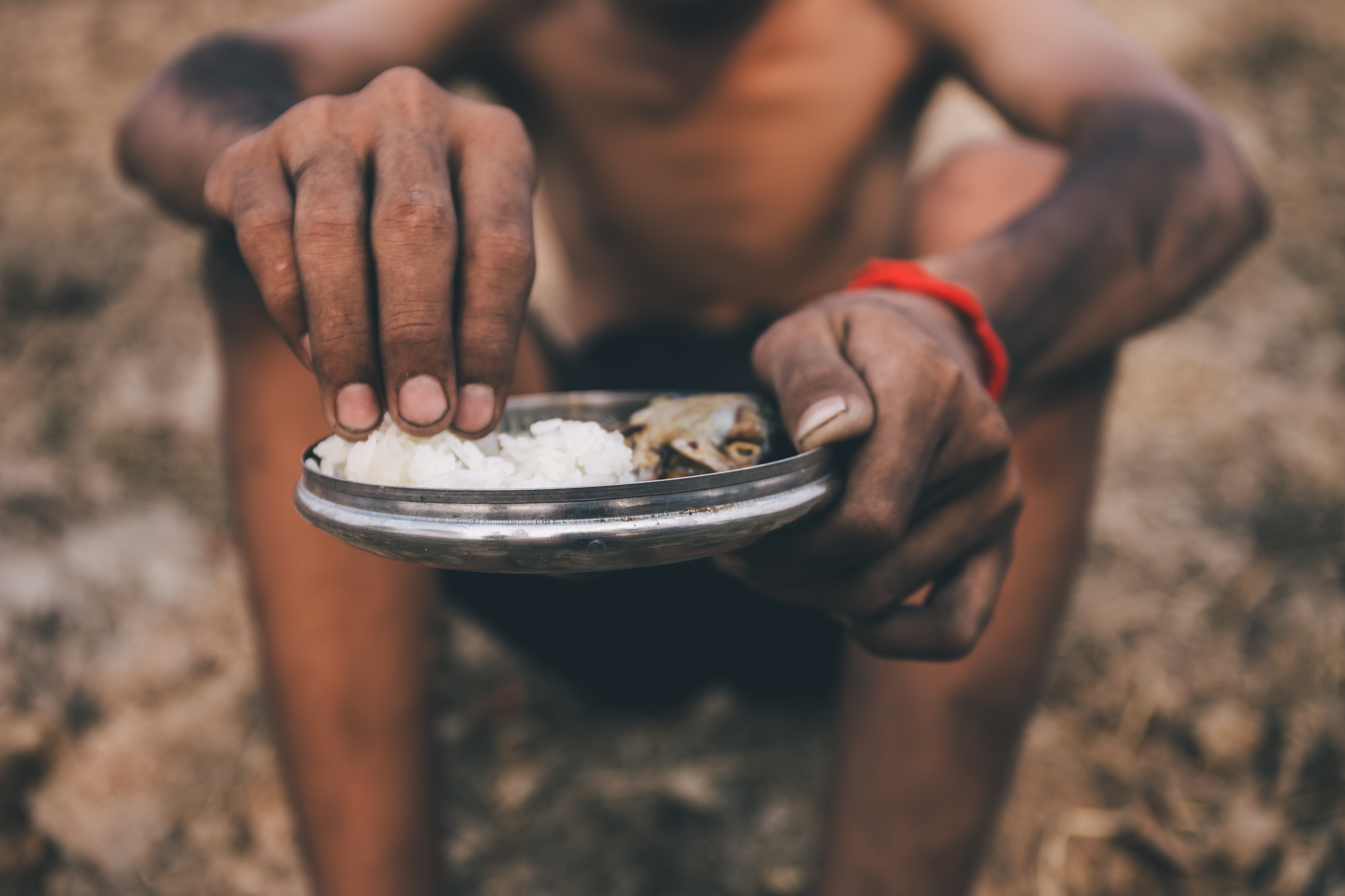Hungry man with bowl of rice